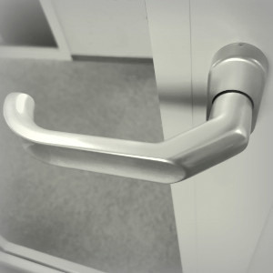 Offset handles for framed doors